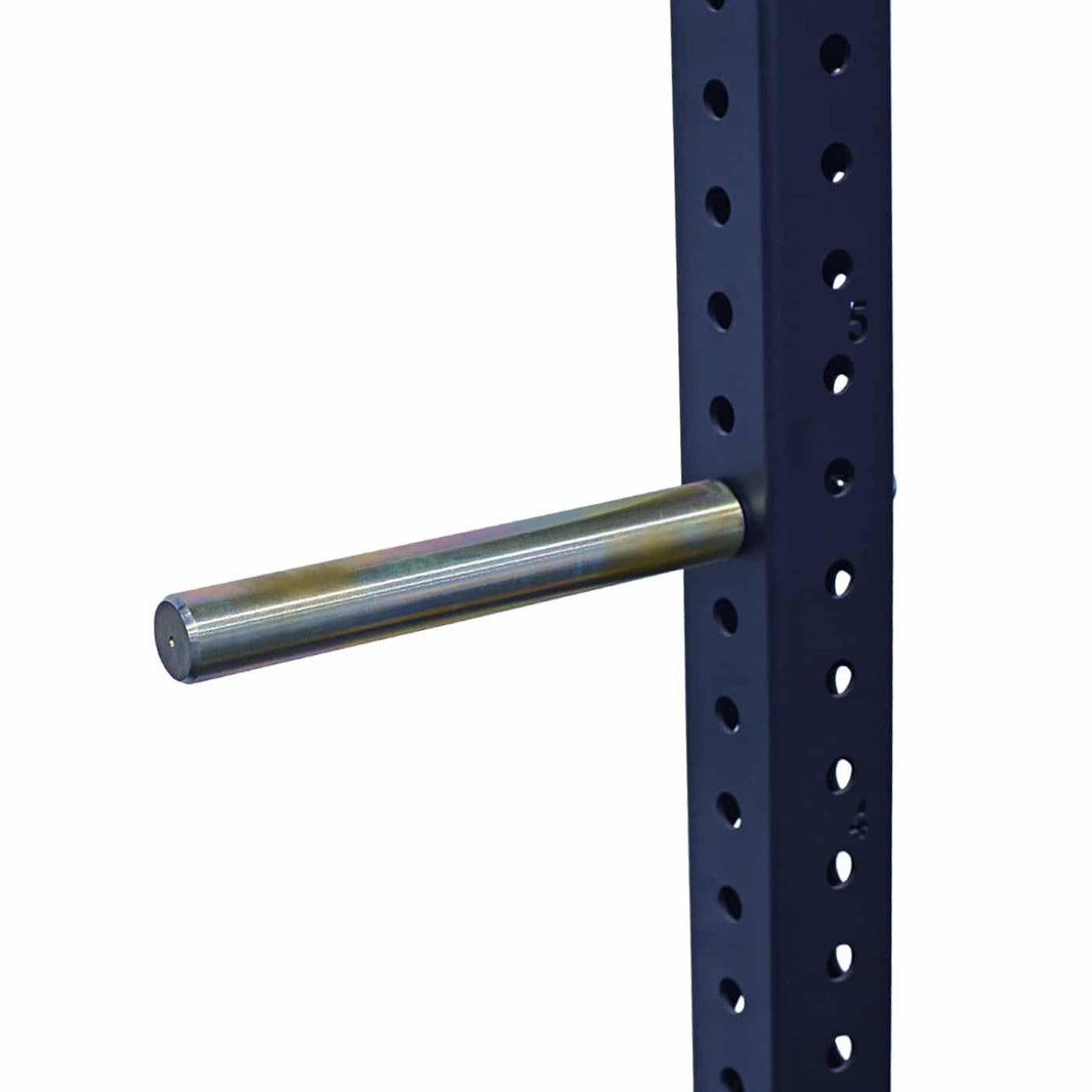 Metal weight plate storage peg attached to a black commercial gym power rack