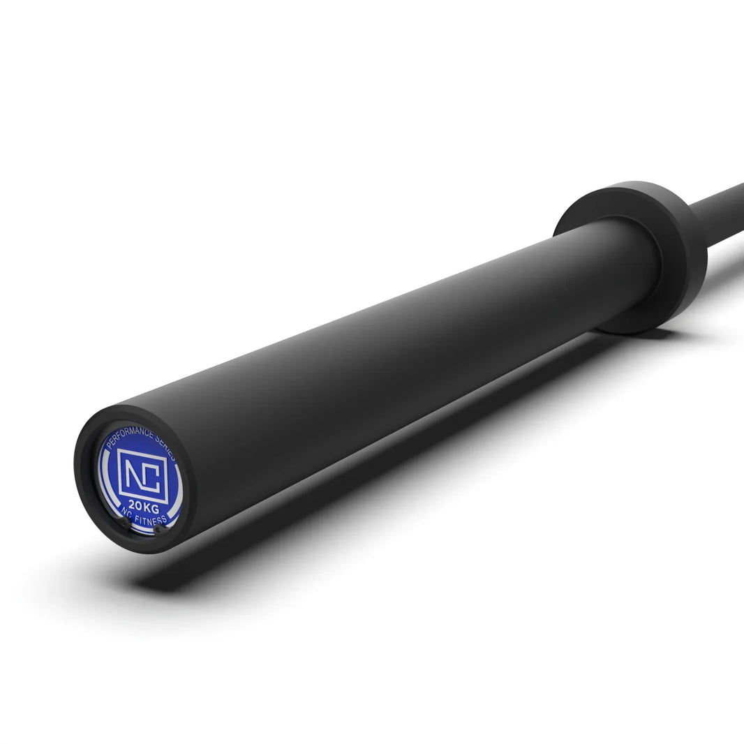 Close-up of a black 20kg NC Fitness barbell with a blue end cap.