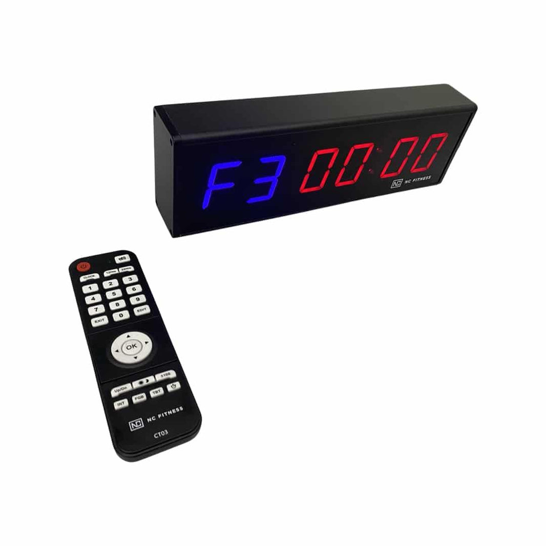 Digital LED gym timer with remote control showing red and blue countdown display.