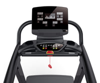 Close-up of a commercial treadmill console with a digital display and control panel.
