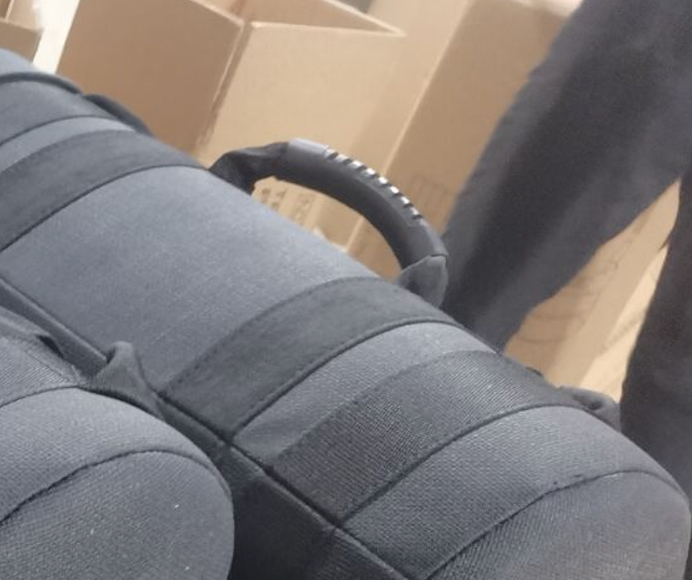 Black padded fitness equipment bag with a sturdy carrying handle.