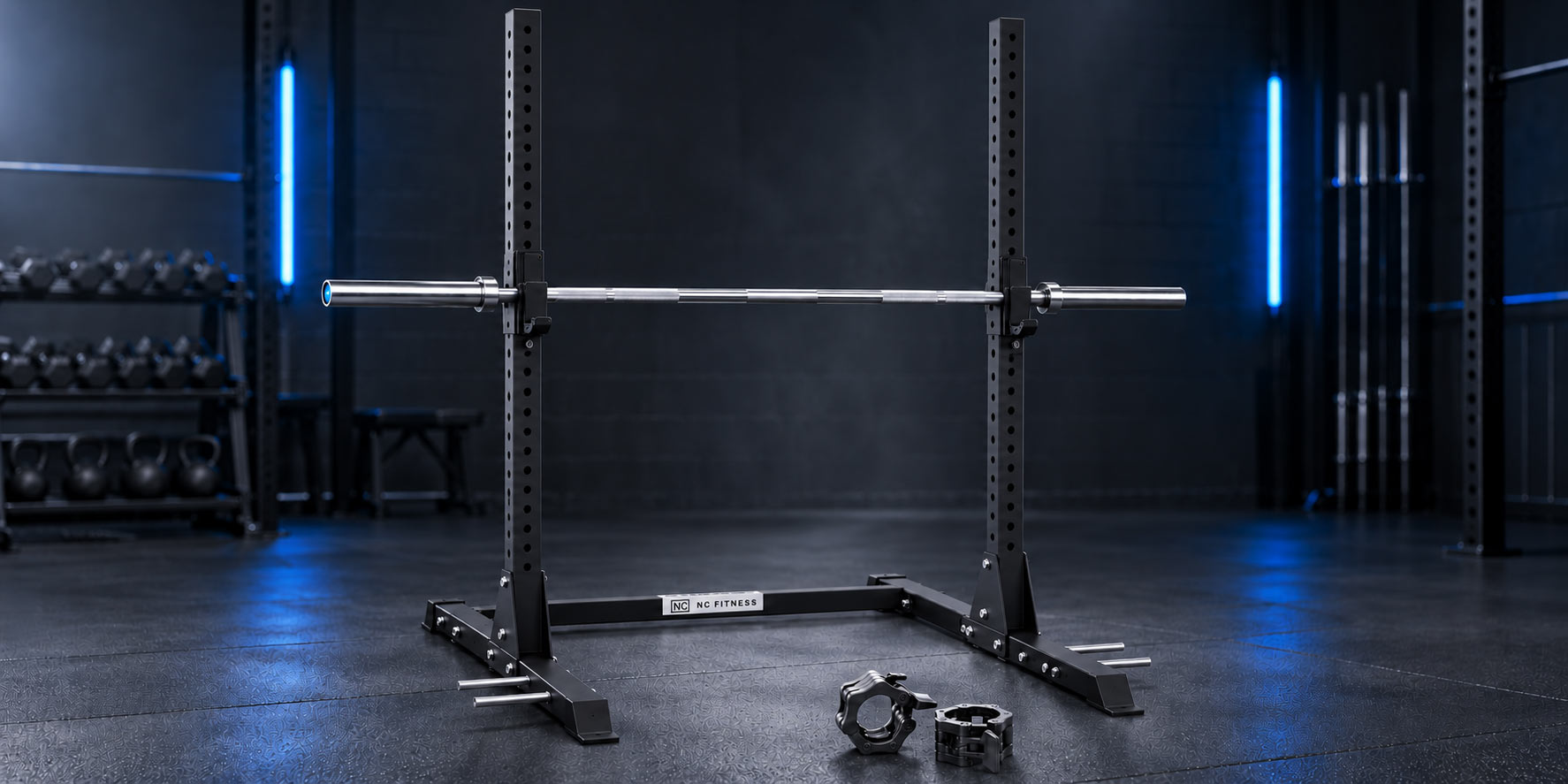 A black power rack with a barbell and two weight plates in the foreground, set in a dark gym environment with blue lighting.